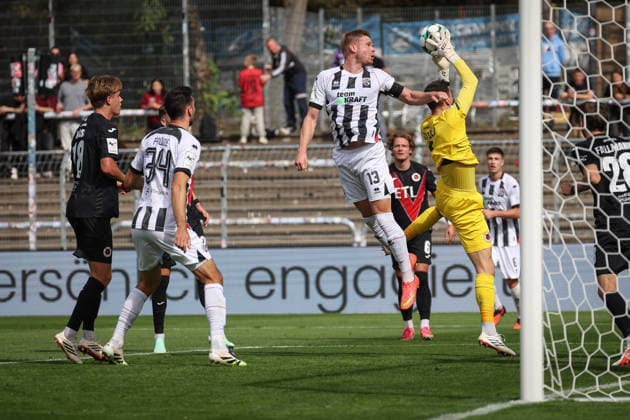3rd Division, 2026–27 Season: Viktoria Köln vs. FC Ingolstadt 04; Lars Lokotsch (No. 13), FCI; Arne Schulz (No. 1), Viktoria Köln; Photo by Jürgen Meyer; 3rd Division, 2026–27 Season: Viktoria Köln vs. FC Ingolstadt 04