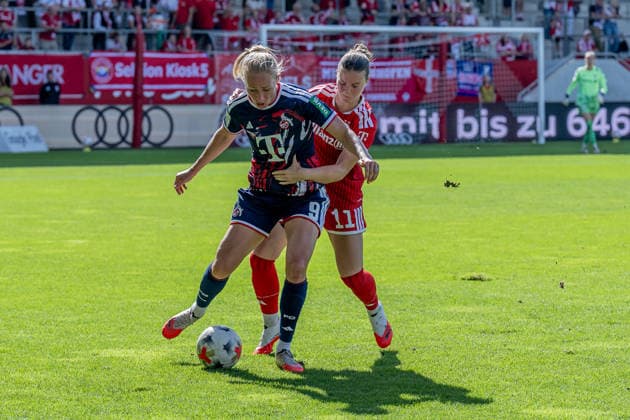 Battle for the Ball: Tackle between Sarah Mattner Trembleau of FC Bayern Munich Women (No. 11) and Pauline Bremer of 1. FC Köln (No. 09, GER), FC Bayern Munich Women vs. 1. FC Köln, Soccer, Google Pixel Women’s Bundesliga, Matchday 5, 2026–2027 Season, September 19, 2026 DFL DFB regulations prohibit any use of photographs as image sequences and or quasi-video. Photo: HMB Media, Heike Feiner Copyright: HMBxMedia HeikexFeiner