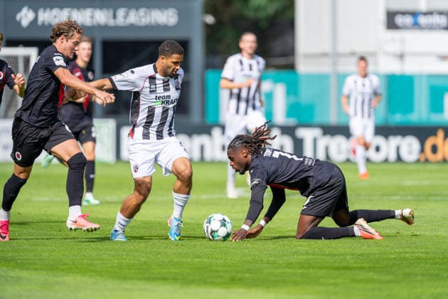 Tobias Eisenhuth of Viktoria Köln, 06, blocks Keanan Bennett of FC Ingolstadt 04, 18, and Yannick Tonye of Viktoria Köln, 07, handles the ball; FC Viktoria Köln vs. FC Ingolstadt 04, soccer, 3rd Division, Matchday 7, 2026–27 season, September 19, 2026, DFL regulations prohibit any use of photographs as image sequences and or quasi-video, FC Viktoria Köln vs. FC Ingolstadt 04, soccer, 3. Liga, Matchday 7, 2026–27 season, September 19, 2026, Cologne Copyright: xEibner-Pressefoto LukasxBaldygax EP_LBA