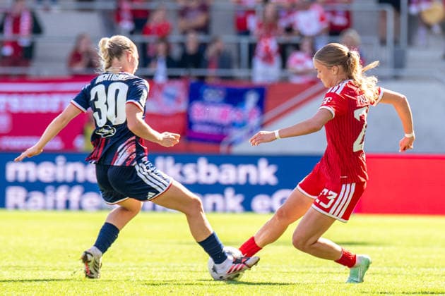 Sophie Nachtigall, 30, of 1. FC Köln, and Sophie Proost, 23, of FC Bayern, in action during the Google Pixel Women’s Bundesliga match between FC Bayern Munich and 1. FC Köln on September 19, 2026, at the FC Bayern Campus in Munich, Bavaria, Germany