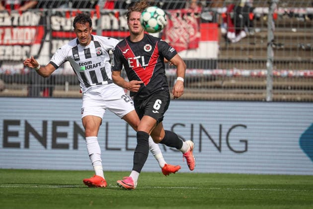 3rd Division, 2026–27 Season: Viktoria Köln vs. FC Ingolstadt 04; Nishan Velupillay (No. 28, FCI) and Tobias Eisenhut (No. 6, Viktoria Köln); Photo by Jürgen Meyer; 3rd Division, 2026–27 Season: Viktoria Köln vs. FC Ingolstadt 04