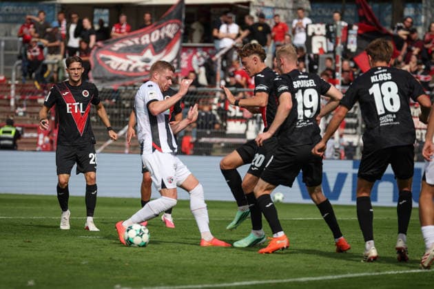 3rd Division, 2026–27 Season: Viktoria Köln vs. FC Ingolstadt 04—Lars Lokotsch (No. 13, FCI) and Niklas Swider (No. 20, Viktoria Köln)—Photo by Jürgen Meyer—3rd Division, 2026–27 Season: Viktoria Köln vs. FC Ingolstadt 04