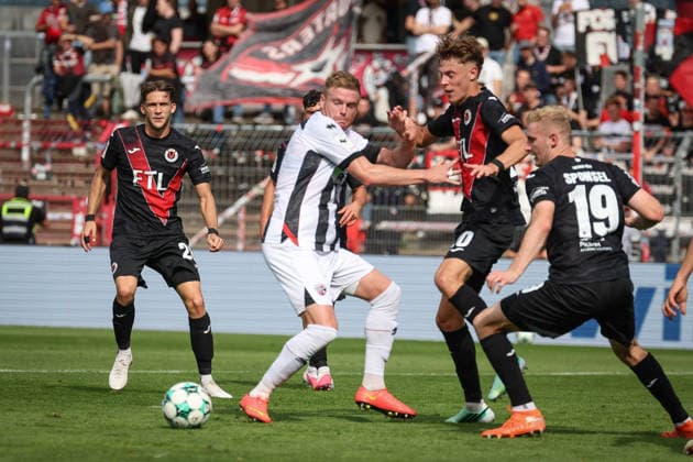 3rd Division, 2026–27 Season: Viktoria Köln vs. FC Ingolstadt 04—Lars Lokotsch (No. 13, FCI) and Niklas Swider (No. 20, Viktoria Köln)—Photo by Jürgen Meyer—3rd Division, 2026–27 Season: Viktoria Köln vs. FC Ingolstadt 04