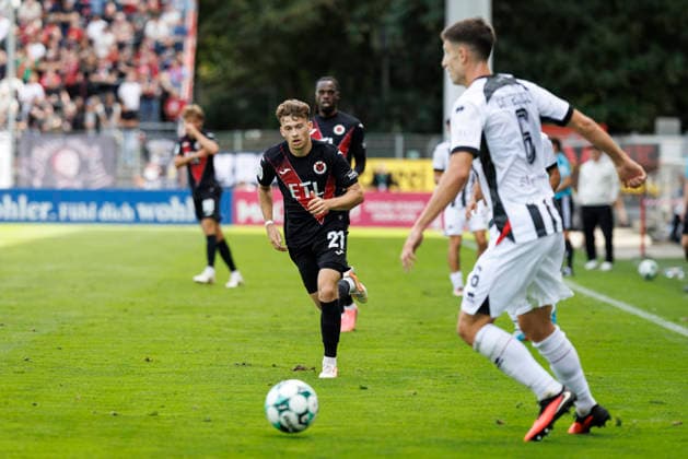 KOELN, GERMANY - SEPTEMBER 19, 2026: Lucas Wolf (Viktoria Köln, 21), Georgios Antzoulas (FC Ingolstadt, 6) during the 3rd division match on gameday 7 between Viktoria Koeln vs. FC Ingolstadt at the Sportpark Hoehenberg on September 19, 2026 in Koeln, Germany. DFL REGULATIONS PROHIBIT ANY USE OF PHOTOGRAPHS AS IMAGE SEQUENCES AND OR QUASI-VIDEO. Nordrhein-Westfalen Germany Copyright: xAxelxKohringx
