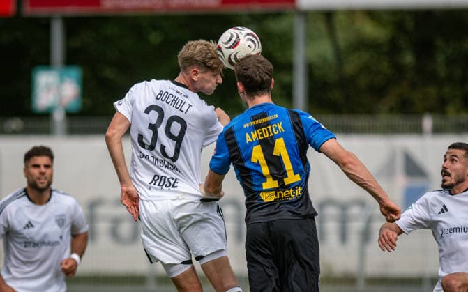 Soccer, 2026–2027 Season, Regionalliga West, September 19, 2026, Matchday 9, Men s, 1 FC Bocholt (white) vs. SC Wiedenbrueck (black); from left: Gianluca Swajkowski (1 FC Bocholt), Maik Amedick (SC Wiedenbrueck); Bocholt Stadion am Huenting, Germany 260919_fb_1fc-bocholt_sc-wiedenbrueck_59025