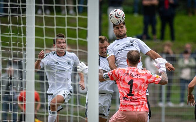 Soccer, 2026–2027 Season, Regionalliga West, September 19, 2026, Matchday 9, Men s, 1 FC Bocholt (white) vs. SC Wiedenbrueck (black); from left: Lennart Garlipp (1 FC Bocholt), Alexander Hahn (1 FC Bocholt), Malek Fakhro (1 FC Bocholt), Marcel Hoelscher (goalkeeper, SC Wiedenbrueck); Bocholt Stadion am Huenting, Germany 260919_fb_1fc-bocholt_sc-wiedenbrueck_58990