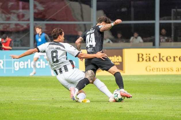 German Soccer, 3rd Division, 2026–27, Matchday 7, September 19, 2026 FC Viktoria Köln vs. FC Ingolstadt 04 Sportpark Höhenberg, Cologne Fredrik Carlsen (FC Ingolstadt 04) commits a foul on Niklas Castelle (Viktoria Köln) in the 44th minute. Cologne, Germany Copyright: xMijoxLubecx