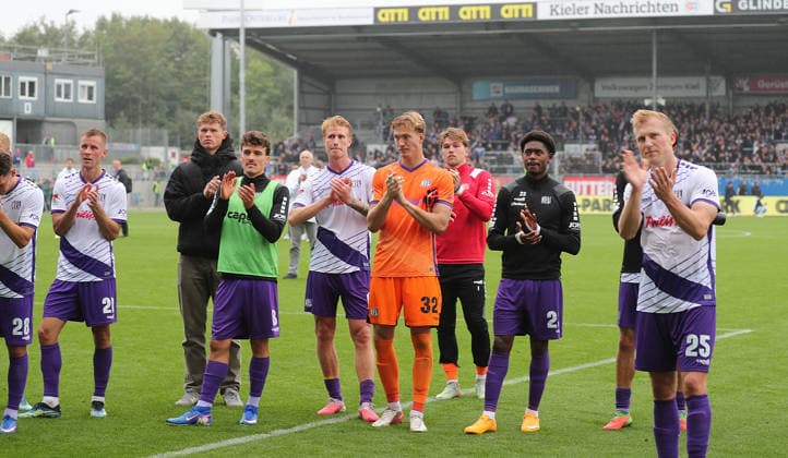 Niklas Wiemann, VfL Osnabrück, and the team celebrate the point in front of the fan section. Soccer, Men s, 2026–2027 Season, 2. Bundesliga, Holstein Stadium, Holstein Kiel vs. VfL Osnabrück, 1–1. DFL regulations prohibit any use of photographs as image sequences and or quasi-video.