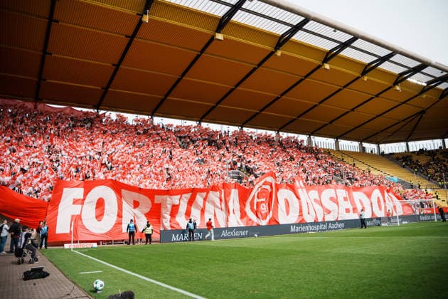 German Soccer 3rd Division 2026–2027, Matchday 7: Alemannia Aachen vs. Fortuna Düsseldorf at Tivoli Aachen; pre-game flag display, away section, Fortuna fans Copyright: xThiemoxRudolphx