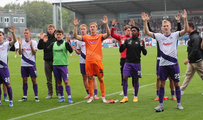 Jonas Krumrey, VfL Osnabrück, and the team celebrate earning a point. Soccer, Men s, 2026–2027 Season, 2. Bundesliga, Holstein Stadium, Holstein Kiel vs. VfL Osnabrück, 1–1. DFL regulations prohibit any use of photographs as image sequences and or quasi-video.