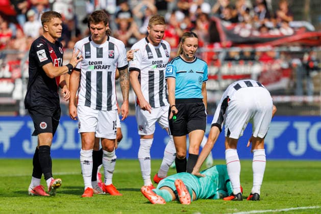KOELN, GERMANY - SEPTEMBER 19, 2026: Referee Fabienne Michel (Gau-Odernheim) decides a foul against Keeper David Klein (FC Ingolstadt, 47) during the 3rd division match on gameday 7 between Viktoria Koeln vs. FC Ingolstadt at the Sportpark Hoehenberg on September 19, 2026 in Koeln, Germany. DFL REGULATIONS PROHIBIT ANY USE OF PHOTOGRAPHS AS IMAGE SEQUENCES AND OR QUASI-VIDEO. Nordrhein-Westfalen Germany Copyright: xAxelxKohringx