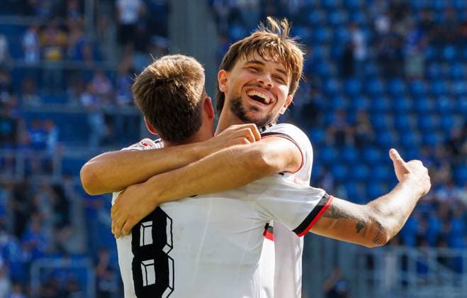 September 19, 2026 Soccer Season 2026–2027, Matchday 2, Bundesliga, Karlsruher SC (KSC) vs. 1. FC Nürnberg (FCN), Club Sports Photo by Zink DaMa xdaxmax. DFL regulations prohibit any use of photographs as image sequences and or quasi-video For editorial use only: Celebrations and joy after the final whistle—Javier Fernandez 8, 1 FC Nürnberg (FCN), and Fynn Otto 20, 1 FC Nürnberg (FCN), embrace each other