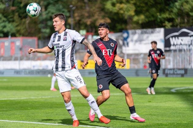 Jonas Scholz of FC Ingolstadt 04, No. 15, holds off Taylan Duman of Viktoria Köln, 08, tackle between FC Viktoria Köln and FC Ingolstadt 04, soccer, 3rd League, Matchday 7, 2026–27 season, September 19, 2026, DFL regulations prohibit any use of photographs as image sequences and or quasi-video, FC Viktoria Köln vs. FC Ingolstadt 04, soccer, 3. Liga, Matchday 7, 2026–27 season, September 19, 2026, Cologne Copyright: xEibner-Pressefoto LukasxBaldygax EP_LBA