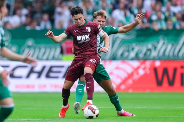 Fabian Rieder of FC Augsburg and Niclas Fuellkrug of Werder Bremen battle for the ball during the Bundesliga match between SV Werder Bremen and FC Augsburg at Weserstadion on September 19, 2026, in Bremen, Germany. Photo by Marco Steinbrenner, DeFodi Images. Fabian Rieder of FC Augsburg and Niclas Füllkrug of Werder Bremen battle for the ball during the Bundesliga match between SV Werder Bremen and FC Augsburg at Weserstadion on September 19, 2026 in Bremen, Germany. Photo by Marco Steinbrenner, DeFodi Images. DFB and DFL regulations prohibit any use of photographs as image sequences and or quasi-video. Photo by Marco Steinbrenner, DeFodi Images