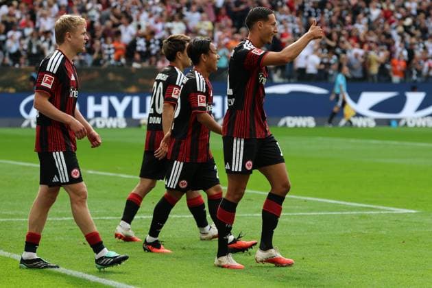 Goal celebration after the 1-0 goal by Younes Ebnoutalib (Eintracht Frankfurt, No. 11), assisted by Ritus Doan (Eintracht Frankfurt, No. 20); Can Uzun (Eintracht Frankfurt, No. 42) and Jonathan Burkhardt join in the celebration, Jonathan Michael Jonny Burkardt, Jonny Burkardt of Eintracht Frankfurt, No. 9, Eintracht Frankfurt vs. SC Freiburg, Bundesliga, BL, 2026–2027 season, Match 4, September 19, 2026, Frankfurt, Deutsche Bank Park, Germany