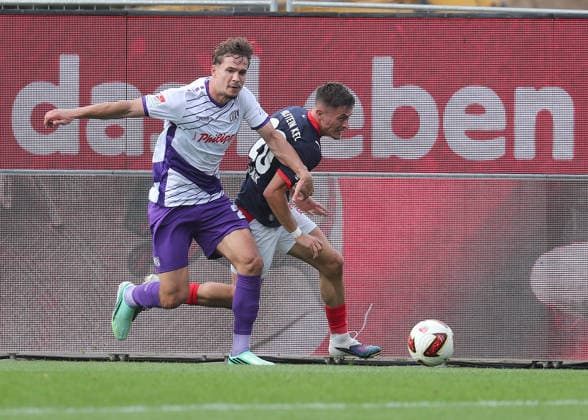 Robin Fabinski, VfL Osnabrück; Adrian Kapralik, Holstein Kiel; Soccer, Men s, 2026–2027 Season, 2. Bundesliga, Holstein Stadium, Holstein Kiel vs. VfL Osnabrück, 1–1. DFL regulations prohibit any use of photographs as image sequences and or quasi-video.