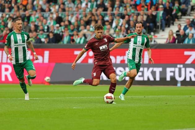 September 26, 2019, GER, Soccer, Men s 1st Division, Matchday 4, 2026–2027 Season, SV Werder Bremen vs. FC Augsburg Goal: 0–1 Scorer: Robin Fellhauer (FC Augsburg 19) scores the 0–1 goal past goalkeeper Karl Hein (SV Werder Bremen 01), no chance for Marco Friedl (SV Werder Bremen 32) and Olivier Deman (SV Werder Bremen 02) at the Weserstadion in Bremen, Germany Copyright: xnordphotoxGmbHx xTauchnitzx