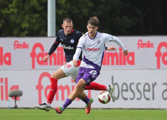 Match between Bernd Riesselmann (VfL Osnabrück) and David Zec (Holstein Kiel) — Men s Soccer, 2026–2027 Season, 2. Bundesliga, Holstein Stadium, Holstein Kiel vs. VfL Osnabrück, 1–1. DFL regulations prohibit any use of photographs as image sequences and or quasi-video.