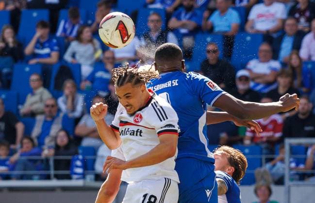 September 19, 2026 Soccer Season 2026–2027 Matchday 2 German Bundesliga Karlsruher SC (KSC) vs. 1. FC Nürnberg (FCN) Club Sports Photo Zink DaMa xdaxmax DFL regulations prohibit any use of photographs as image sequences and or quasi-video For editorial use only. Piet Scobel 19, 1 FC Nuremberg (FCN). Rafael Lubach 18, 1 FC Nuremberg (FCN). Heliton Tito Dos Santos 4, Karlsruher SC (KSC) in a header duel