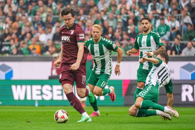 Michael Gregoritsch, FC Augsburg, 11; Youri Regeer, Werder Bremen, 44; tackle, sliding tackle, emotions, German soccer, Bundesliga, 2026–27 season, Matchday 4, September 19, 2026; Werder Bremen vs. FC Augsburg, Weserstadion, Bremen Copyright: xLeonxFrickx