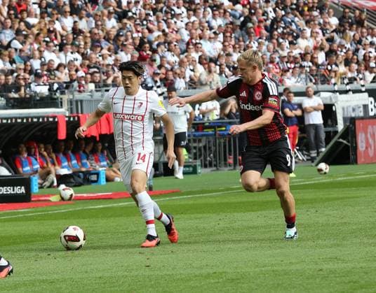 September 19, 2026 xmgoodx Frankfurt am Main, Deutsche Bank Park Bundesliga Season 2026–2027 Eintracht Frankfurt vs. SC Freiburg Jonathan Burkhardt 9, Eintracht Frankfurt vs. Yuito Suzuki, Freiburg; DFL and DFB regulations prohibit any use of photographs as image sequences and or quasi-video