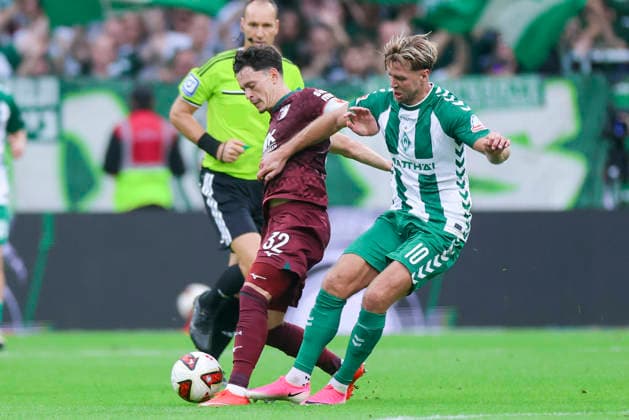 Fabian Rieder of FC Augsburg and Niclas Fuellkrug of Werder Bremen battle for the ball during the Bundesliga match between SV Werder Bremen and FC Augsburg at Weserstadion on September 19, 2026, in Bremen, Germany. Photo by Marco Steinbrenner, DeFodi Images. Fabian Rieder of FC Augsburg and Niclas Füllkrug of Werder Bremen battle for the ball during the Bundesliga match between SV Werder Bremen and FC Augsburg at Weserstadion on September 19, 2026 in Bremen, Germany. Photo by Marco Steinbrenner, DeFodi Images. DFB and DFL regulations prohibit any use of photographs as image sequences and or quasi-video. Photo by Marco Steinbrenner, DeFodi Images