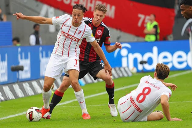 Frankfurt, Germany September 19, 2026 Bundesliga 1 2026–2027 Season Match 4 Eintracht Frankfurt vs. SC Freiburg Pictured, from left, in a tackle: Derry Scherhant (SCF) vs. Elias Baum (Frankfurt) DFL and DFB regulations prohibit any use of photographs as image sequences and or quasi-video Deutsche Bank Park Hesse Copyright: xFotostandx xRacochax