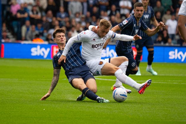 Jarrod Bowen (R) tackled early on by Jenson Metcalfe (L) during the Championship match between Millwall and West Ham at the The Den in London UK (Elliot Legg Sports Press Photo) Copyright: x(ElliotxLegg SportsxPressxPhoto)x Sportspressphoto_SPR234528