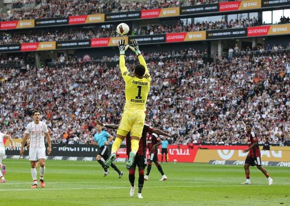 September 19, 2026 xmgoodx Frankfurt am Main, Deutsche Bank Park Bundesliga Season 2026–2027 Eintracht Frankfurt vs. SC Freiburg Goalkeeper Noah Atubolu 1, Eintracht Frankfurt flies toward the ball. DFL and DFB regulations prohibit any use of photographs as image sequences and or quasi-video.