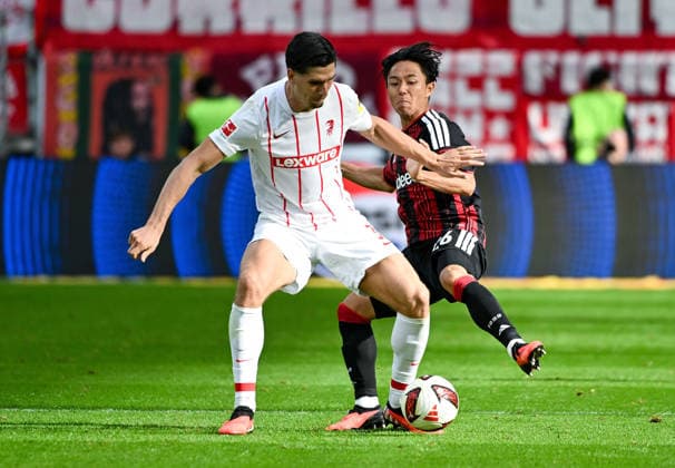 September 19, 2026, xpsx, Soccer 1st Bundesliga, Eintracht Frankfurt vs. SC Freiburg, Igor Matanovic (SC Freiburg), Keita Kosugi (Eintracht Frankfurt). DFL and DFB regulations prohibit any use of photographs as image sequences and or quasi-video. Eintracht Frankfurt