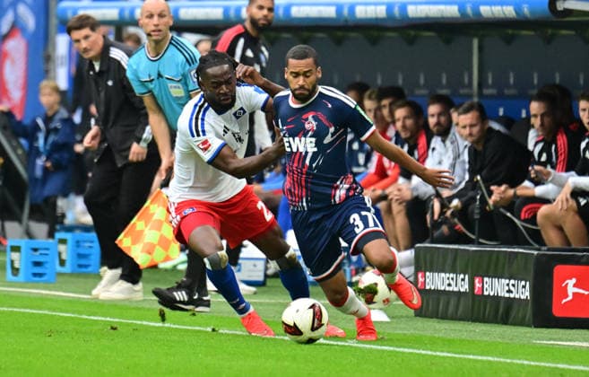 September 19, 2026, German Soccer, Men, 1st Division, Matchday 4, 2026–2027 Season, Hamburg, Hamburger SV vs. 1. FC Köln; Jordan Torunarigha (HSV 23) tries to get past Linton Maina (Köln 37). DFB and DFL regulations prohibit any use of photographs as image sequences and or quasi-video. Hamburg Volksparkstadion, Hamburg, Germany Copyright: xnordphotoxGmbH xWitkex