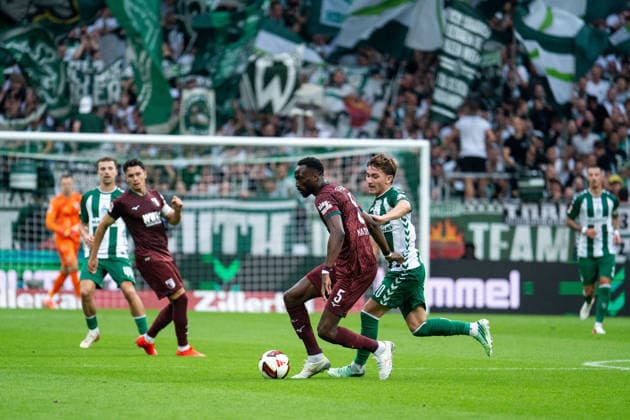 September 19, 2026, GER, Soccer, Men s, Bundesliga 1, 2026–2027 Season, Matchday 4, SV Werder Bremen vs. FC Augsburg: Chrislain Matsima (FC Augsburg) and Chuki (Werder Bremen) in a tackle, 05. DFB and DFL regulations prohibit any use of photographs as image sequences and or quasi-video. Weserstadion, Bremen, Germany Copyright: xNordphoto Memmlerx
