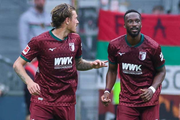 Calvin Brackelmann of FC Augsburg celebrates his goal to make it 0-2 with Chrislain Matsima of FC Augsburg during the Bundesliga match between SV Werder Bremen and FC Augsburg at Weserstadion on September 19, 2026, in Bremen, Germany. Photo by Marco Steinbrenner, DeFodi Images. Calvin Brackelmann of FC Augsburg celebrates after scoring his team’s second goal with Chrislain Matsima of FC Augsburg during the Bundesliga match between SV Werder Bremen and FC Augsburg at Weserstadion on September 19, 2026 in Bremen, Germany. Photo by Marco Steinbrenner, DeFodi Images. DFB and DFL regulations prohibit any use of photographs as image sequences and or quasi-video. Photo by Marco Steinbrenner, DeFodi Images.