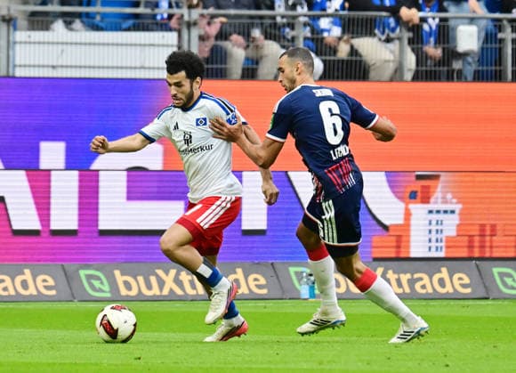 September 19, 2026, German Soccer, Men, 1st Division, Matchday 4, 2026–2027 Season, Hamburg, Hamburger SV vs. 1. FC Köln; Zakaria El Ouahdi (HSV 07) tries to get past Ellyes Skhiri (Köln 06); DFB and DFL regulations prohibit any use of photographs as image sequences and or quasi-video; Hamburg Volksparkstadion, Hamburg, Germany Copyright: xnordphotoxGmbH xWitkex