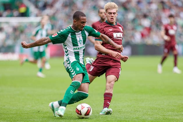 Arthur (SV Werder Bremen, 13) and Hennes Behrens (FC Augsburg, 16) in a one-on-one battle, duel, dynamic moment, action, game scene, DFL REGULATIONS PROHIBIT ANY USE OF PHOTOGRAPHS AS IMAGE SEQUENCES AND OR VIDEO-LIKE PHOTO SERIES DFL REGULATIONS PROHIBIT ANY USE OF PHOTOGRAPHS AS IMAGE SEQUENCES AND OR QUASI-VIDEO, September 19, 2026, Bremen, Germany, soccer, Bundesliga, SV Werder Bremen vs. FC Augsburg xobx