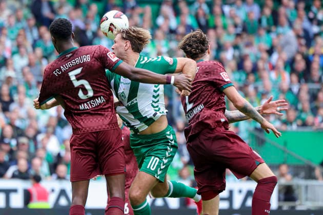 Chrislain Matsima (FC Augsburg), Niclas Füllkrug (Werder Bremen), and Calvin Brackelmann (FC Augsburg) battle for the ball during the Bundesliga match between SV Werder Bremen and FC Augsburg at Weserstadion on September 19, 2026, in Bremen, Germany. Photo by Marco Steinbrenner, DeFodi Images. Chrislain Matsima (FC Augsburg), Niclas Füllkrug (Werder Bremen), and Calvin Brackelmann (FC Augsburg) battle for the ball during the Bundesliga match between SV Werder Bremen and FC Augsburg at Weserstadion on September 19, 2026 in Bremen, Germany. Photo by Marco Steinbrenner, DeFodi Images. DFB and DFL regulations prohibit any use of photographs as image sequences and or quasi-video. Photo by Marco Steinbrenner, DeFodi Images.