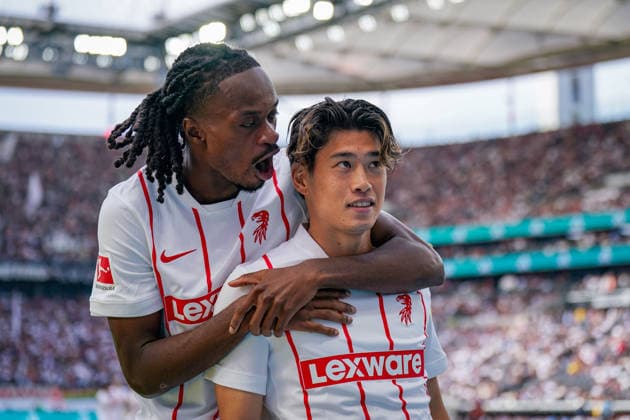 Germany Soccer Bundesliga 2026–2027, Matchday 4: Eintracht Frankfurt vs. SC Freiburg at Deutsche Bank Park in Frankfurt. Goal and celebration following the 2–2 equalizer by Yuito Suzuki of SC Freiburg (No. 14); joy, emotion, and celebration with Jordy Makengo of SC Freiburg (No. 33). Copyright: xJOERANxSTEINSIEKx