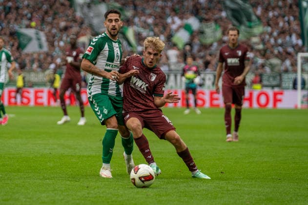 German Soccer 1st Bundesliga, Matchday 4, 2026–2027, Werder Bremen vs. FC Augsburg on September 19, 2026, at the Weserstadion in Bremen. Tackle: Hennes Behrens (FC Augsburg), 16; Ludovit Reis (Werder Bremen), 15 Copyright: xSvenxHeidmannx