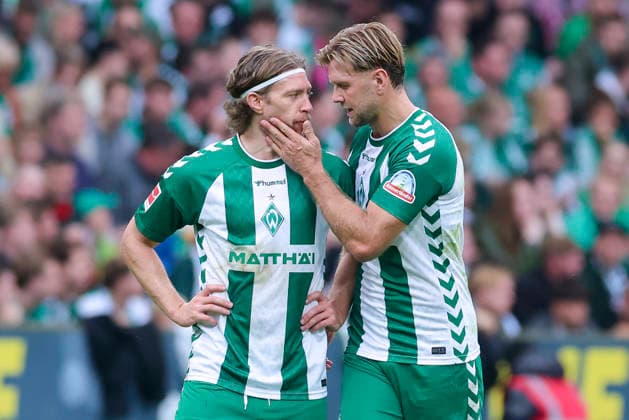 Mitchell Weiser of Werder Bremen and Niclas Füellkrug of Werder Bremen look disappointed during the Bundesliga match between SV Werder Bremen and FC Augsburg at Weserstadion on September 19, 2026, in Bremen, Germany. Photo by Marco Steinbrenner, DeFodi Images. Mitchell Weiser of Werder Bremen and Niclas Füllkrug of Werder Bremen look dejected during the Bundesliga match between SV Werder Bremen and FC Augsburg at Weserstadion on September 19, 2026 in Bremen, Germany. Photo by Marco Steinbrenner, DeFodi Images. DFB and DFL regulations prohibit any use of photographs as image sequences and or quasi-video. Photo by Marco Steinbrenner, DeFodi Images