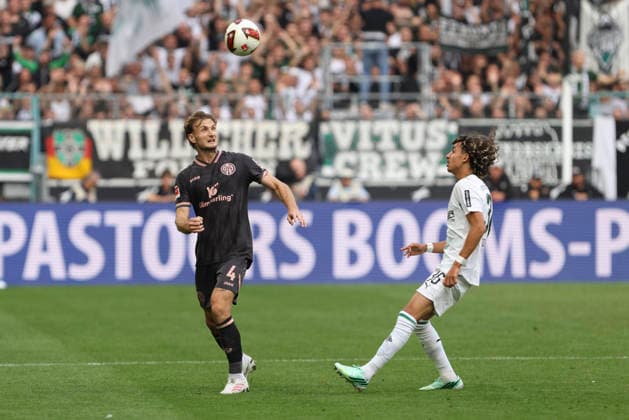 Stefan Posch of 1. FSV Mainz 05 and Wael Mohya of Borussia Mönchengladbach in a tackle during the Bundesliga match between Borussia Mönchengladbach and 1. FSV Mainz 05, at Borussia Park on September 19, 2026, in Mönchengladbach, Germany. Photo by Oliver Kaelke, DeFodi Images. Stefan Posch of 1. FSV Mainz 05 and Wael Mohya of Borussia Mönchengladbach battle for the ball during the Bundesliga match between Borussia Mönchengladbach and 1. FSV Mainz 05 at ista Borussia Park on September 19, 2026 in Mönchengladbach, Germany. Photo by Oliver Kaelke, DeFodi Images. DFB and DFL regulations prohibit any use of photographs as image sequences and or quasi-video. Photo by Oliver Kaelke, DeFodi Images.