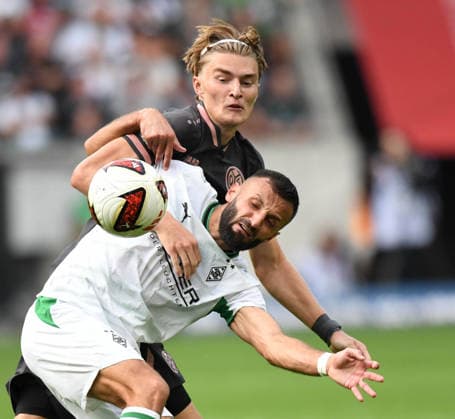 September 19, 2026, xophax, Soccer, 1. Bundesliga, DFL, Borussia Mönchengladbach vs. 1. FSV Mainz 05, Kacper Potulski (Mainz 05), in the back and Franck Honorat, Mönchengladbach. DFL and DFB regulations prohibit any use of photographs as image sequences and or quasi-video. Mönchengladbach