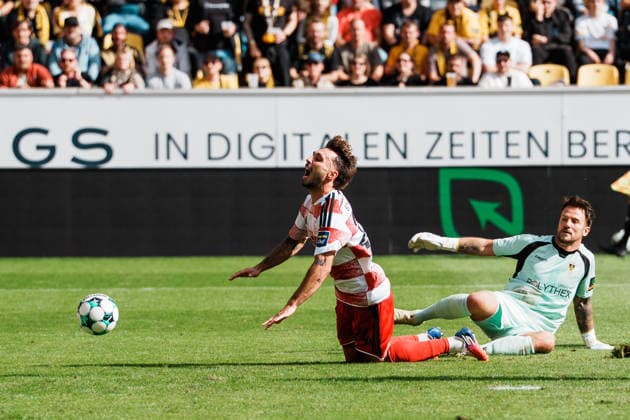 Germany Soccer 3rd Division 2026–2027, Matchday 7: Alemannia Aachen vs. Fortuna Düsseldorf at Tivoli Aachen. Fabian Schleusener of Fortuna Düsseldorf, No. 24, goes down in the penalty area, facing Alemannia Aachen’s Manuel Riemann one-on-one. No penalty. Duel. Tackle. Copyright: xThiemoxRudolphx