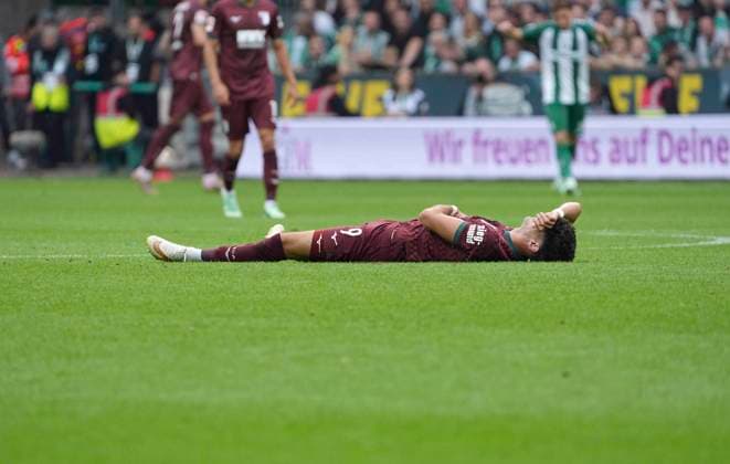 Photo: Loser on the ground, Rodrigo RIBEIRO, Augsburg Soccer, Bundesliga 1, Matchday 30 on Sat, Sept. 19, 2026: Werder Bremen vs. FC Augsburg, 3–2