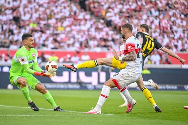 Goalkeeper Fabian Bredlow of VfB Stuttgart, Jeff Chabot of VfB Stuttgart, and Maximilian Beier of Borussia Dortmund in a tackle during the Bundesliga 1 match between VfB Stuttgart and Borussia Dortmund, at the MHPArena on September 19, 2026, in Stuttgart, Germany. Photo by Harry Langer, DeFodi Images. Goalkeeper Fabian Bredlow of VfB Stuttgart, Jeff Chabot of VfB Stuttgart, and Maximilian Beier of Borussia Dortmund battle for the ball during the Bundesliga match between VfB Stuttgart and Borussia Dortmund at MHPArena on September 19, 2026, in Stuttgart, Germany. Photo by Harry Langer, DeFodi Images. DFB and DFL regulations prohibit any use of photographs as image sequences and or quasi-video. Photo by Harry Langer, DeFodi Images. DFB and DFL regulations prohibit any use of photographs as iMASEQUENCES AND OR QUASI-VIDEO