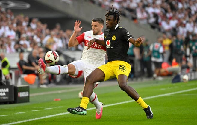 Tackle, Action: Ermedin Demirovic (VfB Stuttgart 09) vs. Joane Gadou (Borussia Dortmund BVB 22), VfB Stuttgart vs. Borussia Dortmund BVB, September 19, 2026. DFL regulations prohibit any use of photographs as image sequences and or quasi VIDEO VfB Stuttgart vs. Borussia Dortmund BVB
