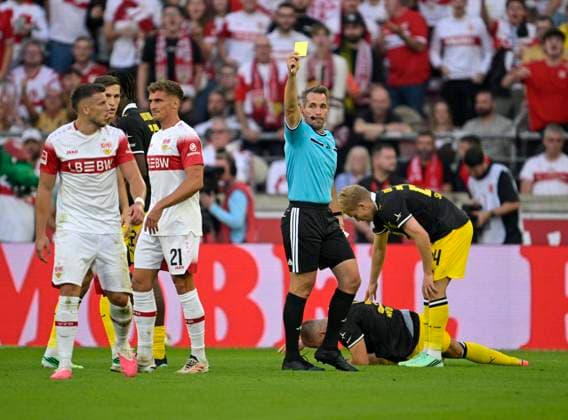 September 19, 2026, Soccer, Bundesliga 1, 2026–2027, Matchday 4, VfB Stuttgart vs. Borussia Dortmund, at the MHP Arena in Stuttgart, Ermedin Demirovic of Stuttgart receives a yellow card from referee Tobias Stieler. Germany