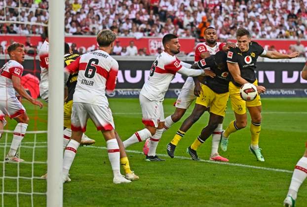 September 19, 2026, Soccer, 1. Bundesliga 2026–2027, Matchday 4, VfB Stuttgart vs. Borussia Dortmund, at the MHP Arena in Stuttgart, Nico Schlotterbeck (Borussia Dortmund) and Serhou Yadaly Guirassy (Borussia Dortmund) vs. Deniz Undav (Stuttgart) and Angelo Stiller (Stuttgart)