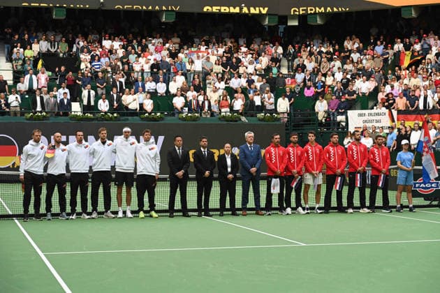 The teams have taken their positions: Germany on the left, Croatia on the right. Match 1: Alexander ZVEREV (GER) vs. Matej DODIC (CRO). Germany (GER) vs. Croatia (CRO). Tennis Davis Cup Qualifiers, Round 2, on September 19, 2026, at the Heristo Arena in Westphalia, Germany. Â