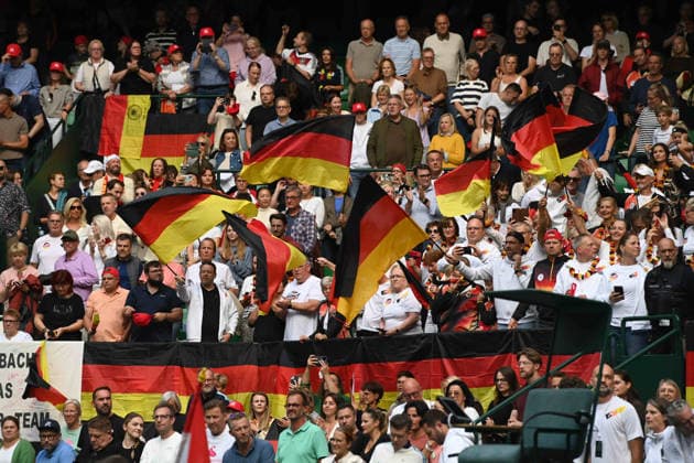 German fans with their flags, feature, background image, symbolic photo, match 1: Alexander ZVEREV (GER) vs. Matej DODIC (CRO), Germany (GER) vs. Croatia (CRO), Tennis, Davis Cup Qualifiers, Round 2, on September 19, 2026, at the Heristo Arena in Halle, Westphalia, Germany Â