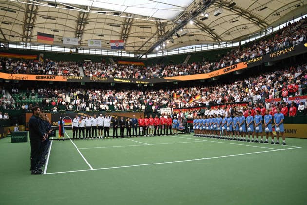 The teams have taken their positions, with Germany on the left and Croatia on the right. Match 1: Alexander ZVEREV (GER) vs. Matej DODIC (CRO). Germany (GER) vs. Croatia (CRO). Tennis Davis Cup Qualifiers, Round 2, on September 19, 2026, at the Heristo Arena in Westphalia, Germany. Â